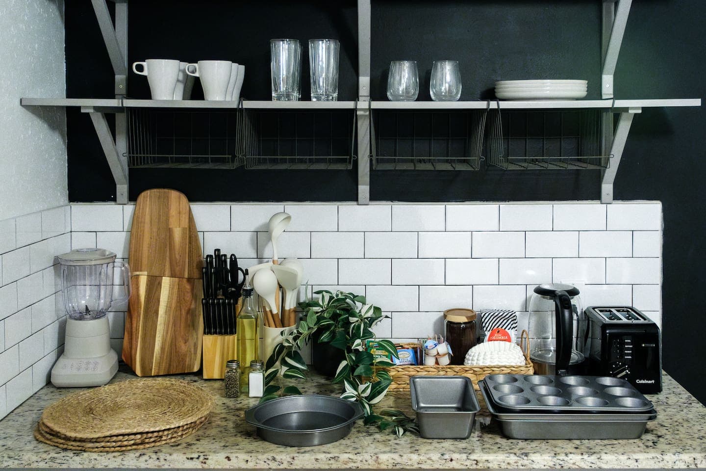 Baking essentials: cupcake and baking pan, spatulas, a cake round, a loaf pan, and tinfoil